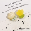 Detail of 22mm tulip resin charms in cream matte and yellow translucent finishes - Flocked Yellow Flower
