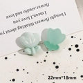 Detail view of mint green tulip charms in resin and flocking material with 22mm x 18mm size - Flocked Light Blue Flower