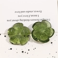 Detailed close-up of green resin flower hair clip accessories with transparent texture - Fruit Green