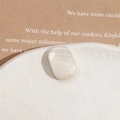 Macro detail of oval cream resin cabochon with cat eye effect for DIY jewelry making - White Rectangle