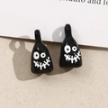 Close-up of DIY black ghost pendants with white eyes for Halloween jewelry making - Black (B68-5-4)