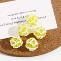 Macro detail of 5 yellow crystal beads with white hand-woven mesh for DIY jewelry making - 1 Piece / Yellow