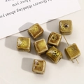 Macro shot of cubic ceramic beads with brown speckled glaze and through-hole for DIY jewelry - 12mm (1 Piece) / Ginger Yellow