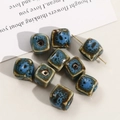 Macro detail of square ceramic beads with gradient blue glaze and kiln-fired texture - 12mm (1 Piece) / Blue