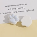 Detailed view of DIY cat paw resin patches with soft blue flocking and smooth white back - Blue