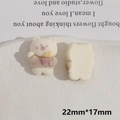 Macro shot showing front and back of cartoon bear resin charms with flocked texture - White Fries Bear