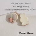 Detail of DIY flocking rabbit resin patch holding an orange carrot for handmade crafts - Brown Rabbit with White Hat