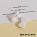 Détail de breloques DIY en résine de 15x23mm en forme d'os avec flocage et smiley - Os Blanc