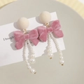 Elegant pink velvet bow earrings with long white pearl tassels and plush round stud detail - Pink