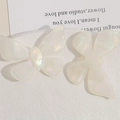 Macro detail of iridescent butterfly hair accessories in a creamy translucent white finish - Iridescent White Butterfly (Style 1)