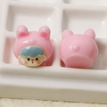Macro view of miniature resin rabbit girl figurines for DIY hair accessories - Pink Rabbit Baby
