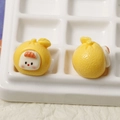 Macro shot of 3D resin fruit baby charms showing front and back details for DIY crafts - Yellow Fruit Baby
