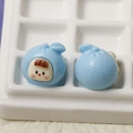 Macro shot of cute light blue fruit baby resin charm for DIY hair clips and jewelry - Blue Fruit Baby