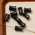 Macro detail of hourglass-shaped blue sandstone beads with sparkling finish for DIY jewelry - Blue Sandstone