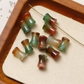 Detailed view of waist-drum shaped natural agate beads for DIY jewelry making - Agate