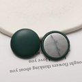Detail of dark green lychee pattern leather round button with silver metal flat back - Dark Green