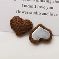 Detail showing knitted heart charm with 3D texture and metallic silver backing for DIY - Dark Brown