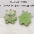 Detail view showing front and back of green flocked dog monster resin DIY accessories - Green Horned Monster