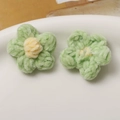 Detailed view of handmade green and yellow plush puff flowers for DIY jewelry making - Green Petal Yellow Core