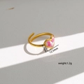 Detail view of heart-shaped gold ring featuring pink preserved flower inlay and dimensions - Style 356
