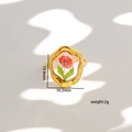 Macro shot of gold ring with real dried red flower and leaf in clear resin dome - Style 368