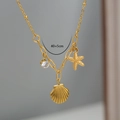 Detalle del collar océano chapado en oro de 18K con concha, estrella de mar y circón - Estilo Oceánico Dorado (4-10)
