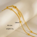 Dettaglio della collana in acciaio inossidabile placcato oro 18K con perle e chiusura a moschettone - Catena con Sfere Oro (7-4)