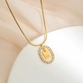 Gold stainless steel necklace with sparkling crystal oval frame and letter M pendant - M