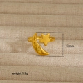 Detailed macro view of 18K gold crescent moon and star ring on a linen jewelry tray - Star Moon Relief Style (22) / Gold