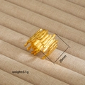 Macro shot of 20mm wide gold stainless steel ring with textured wavy woven pattern - Irregular Rippled Interwoven Style (32) / Gold