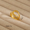 Macro detail of irregular 18K gold plated stainless steel ring, 12mm width and 1.9g weight - Geometric Interwoven Style (36)