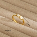 Macro detail of gold ring with wavy texture and three 5.5mm white inlaid stones - Three-Bead Wave Style (38)