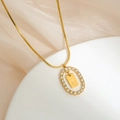 Gold letter S pendant necklace with shimmering crystals on a sleek snake chain - S
