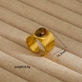 Detail view of gold open ring with tiger eye stone and radial texture, 14.3mm wide - Tiger Eye Pattern Style (70)