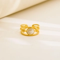Macro shot of gold vintage ring with twisted bands, white inlay and shell details - Triple Twist White Inlay Design / Gold