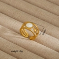 Detailed macro of a 10mm golden irregular ring with white shell inlay and shell charms - Star Moon Shell Twisted Rope Style (79)