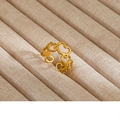 Macro shot of gold vintage enamel pearl ring featuring hollow heart patterns on a velvet tray - Gold Hollow Heart Pattern Style (11)