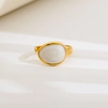 Detail of a vintage gold adjustable ring featuring a white oval enamel spiral pattern - Oval White Spiral Texture Design / Gold