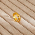 Macro view of golden leaf-shaped open ring displayed in a beige velvet jewelry box - Gold Leaf Wheat Ear Shape Style (17)