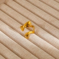 Detailed macro shot of a golden stainless steel embrace ring with polished finish - Gold Hands Hugging Shape Style (21)