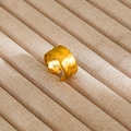 Detailed view of wide gold-plated ring with hammered texture on a linen jewelry tray - Gold Wide Band Hammered Style (8)