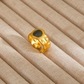 Detailed view of gold hammered ring with black stone inlay on velvet tray - Gold Black Circular Hammered Style (68)
