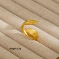 Detail of 18K gold-plated stainless steel ring with textured wing design and adjustable band - Double Wing Feather Open Style (114)