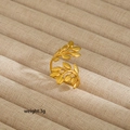 Detailed view of adjustable golden leaf ring weighing 3g on a beige fabric tray - Gold Leaf Style (217) / Gold