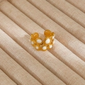 Detail of gold-plated double-row open ring with white stone inlays on beige jewelry stand - Gold Double Layer White Inlay Style (74)