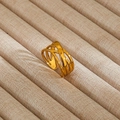 Detail view of gold crisscross hollow ring on beige linen jewelry display tray - Gold Hollow Criss-Cross Wrap Style (85)