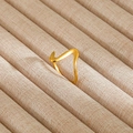 Detail of a wavy geometric gold ring with matte finish on a beige velvet jewelry tray - Gold Matte Wave Geometric Style (88)