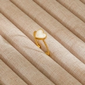 Elegant gold-plated twist ring featuring a white heart-shaped stone in a minimalist style - Gold Twisted Rope White Heart Inlay Style (243)