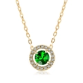 Macro detail of gold plated necklace with a round green gemstone and halo diamonds - Gold Green Stone
