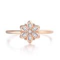 Detail of rose gold flower ring with marquise-cut zircons and polished finish - US 5 / Rose Gold White Stone